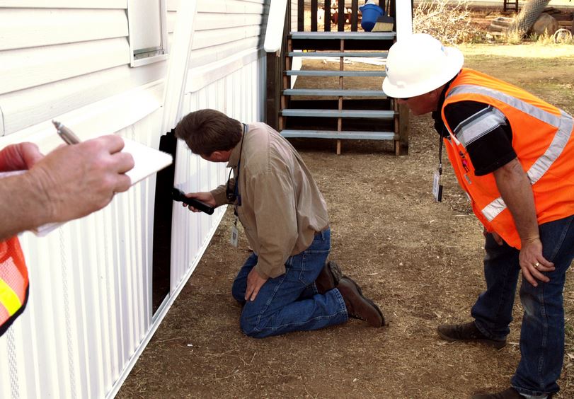 home inspector at a trailer home